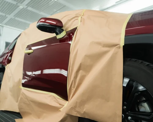 car-covered-with-masking-tape-and-paper-is-in-the-2026-03-10-01-10-36-utc