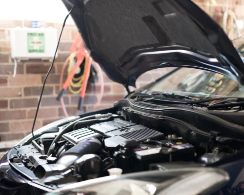 car-with-open-hood-awaiting-repair-in-garage-2026-03-24-10-24-41-utc