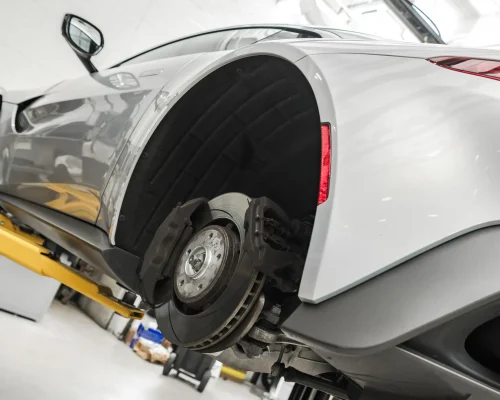 performance-car-on-automotive-lift-during-maintena-2026-01-08-23-39-00-utc